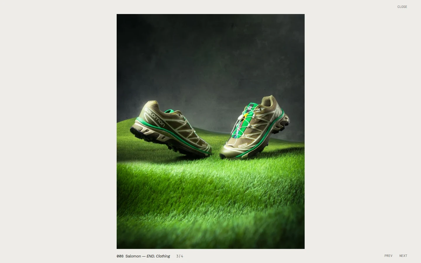 The viewer open at 1440 px: a Salomon trainer photograph on grass, centred on the pale grey, with the credit 008 Salomon for END. Clothing and 3 of 4 below it, Close at the top right, and Prev and Next at the lower right.